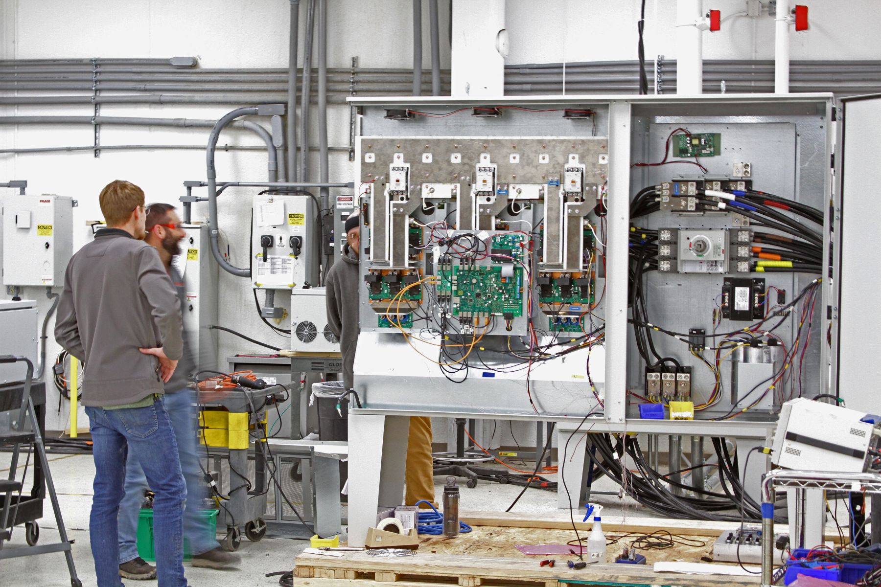 Phase technicians testing drives on the production floor